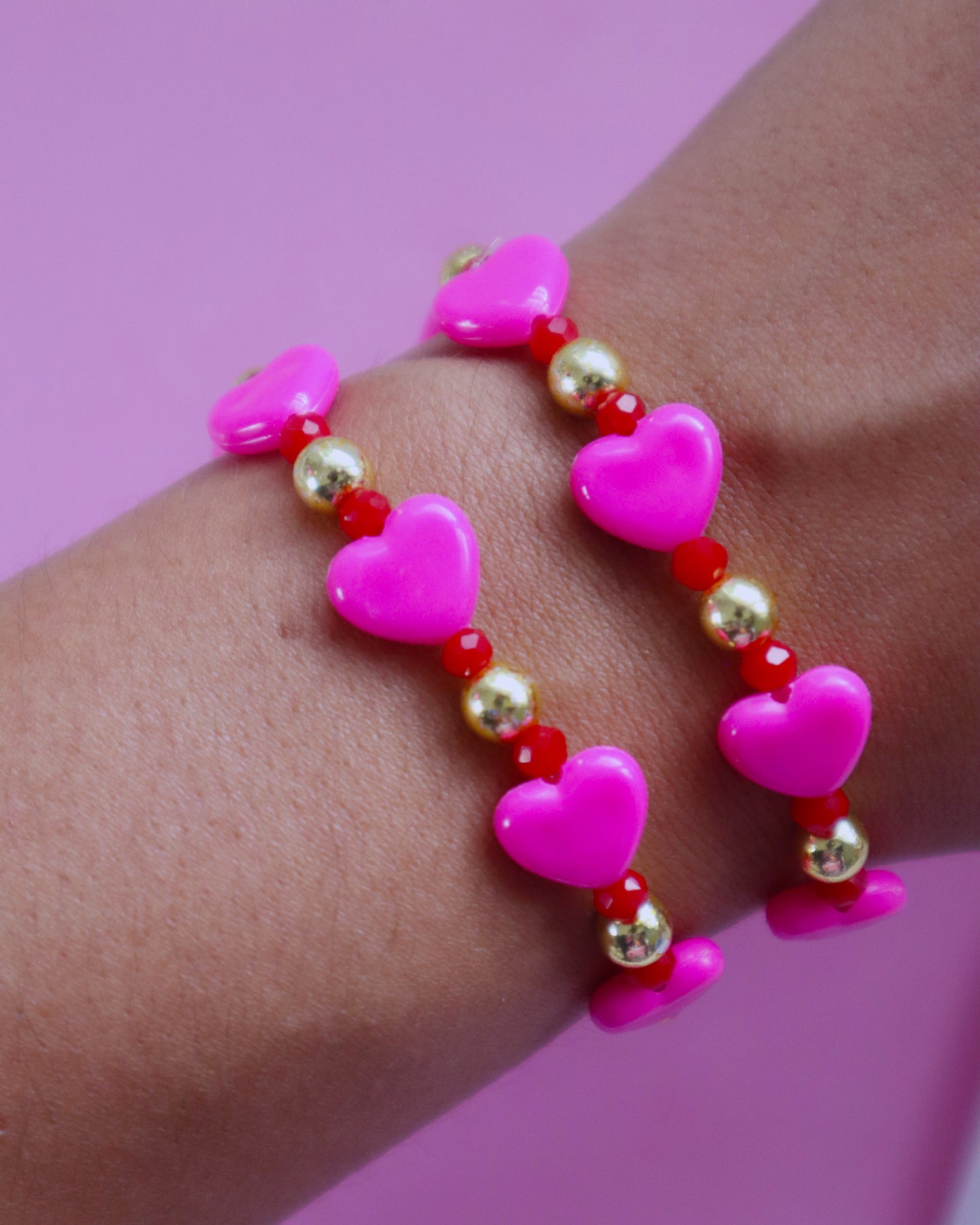 Pink and red bracelets