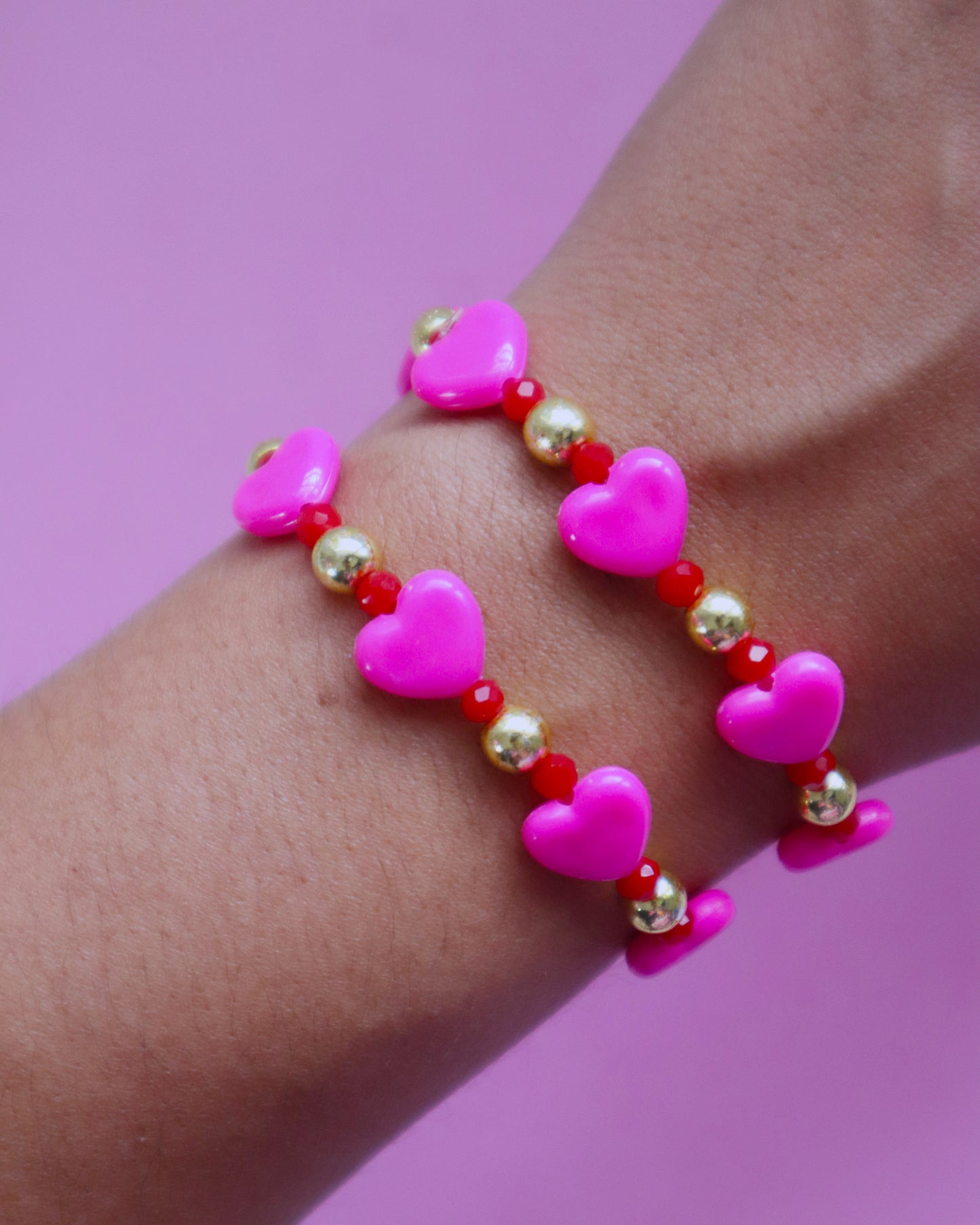 Pink and red bracelets