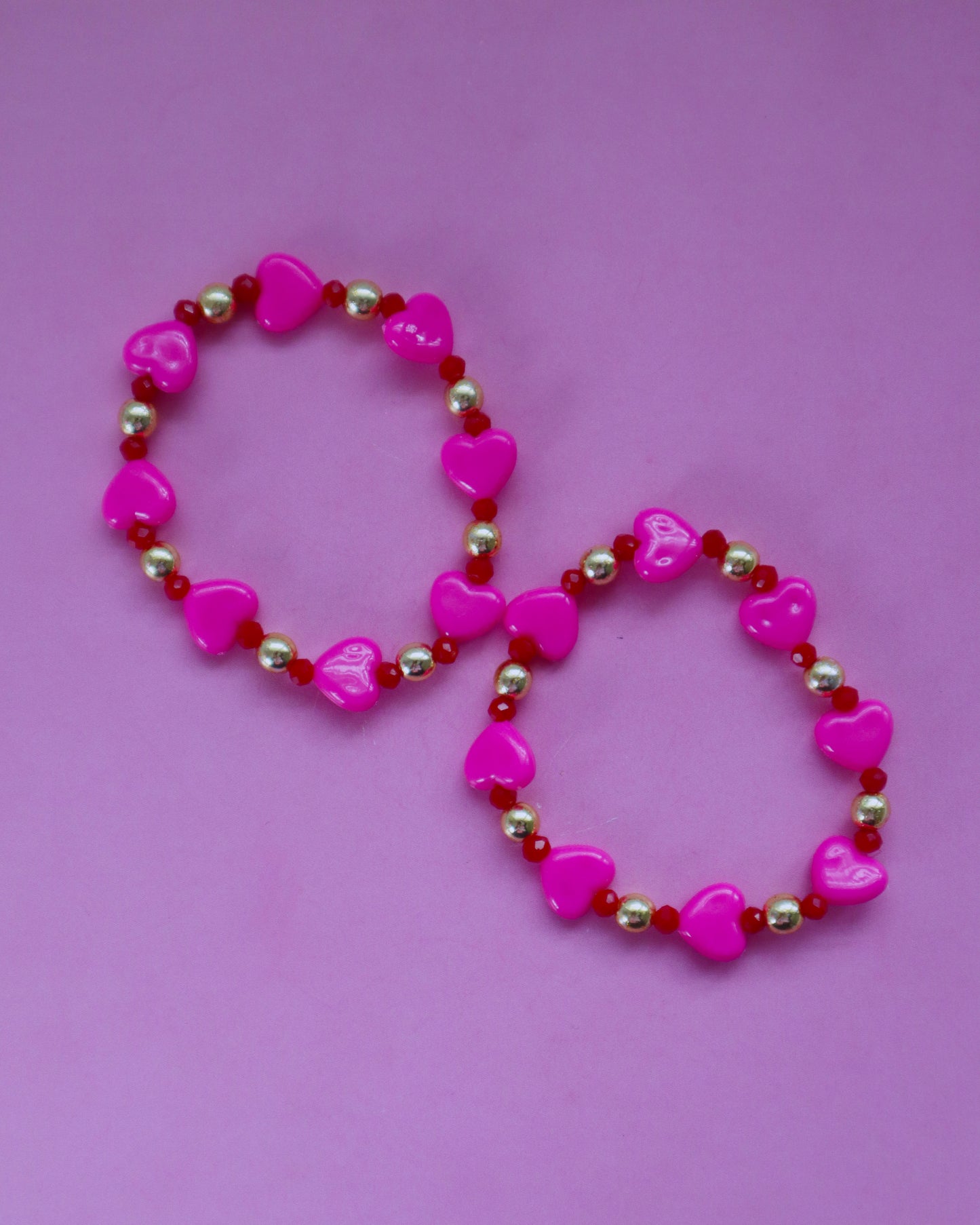 Pink and red bracelets